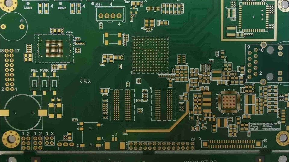 Green bare circuit board with dense copper traces and component footprints