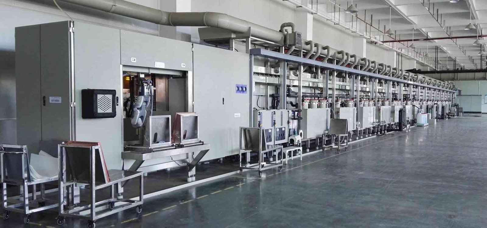Long row of electronic assembly equipment and conveyors in a production area