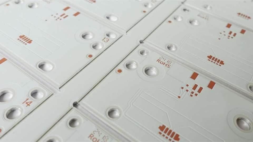 White circuit-board panels with repeated lighting footprints and mounting holes